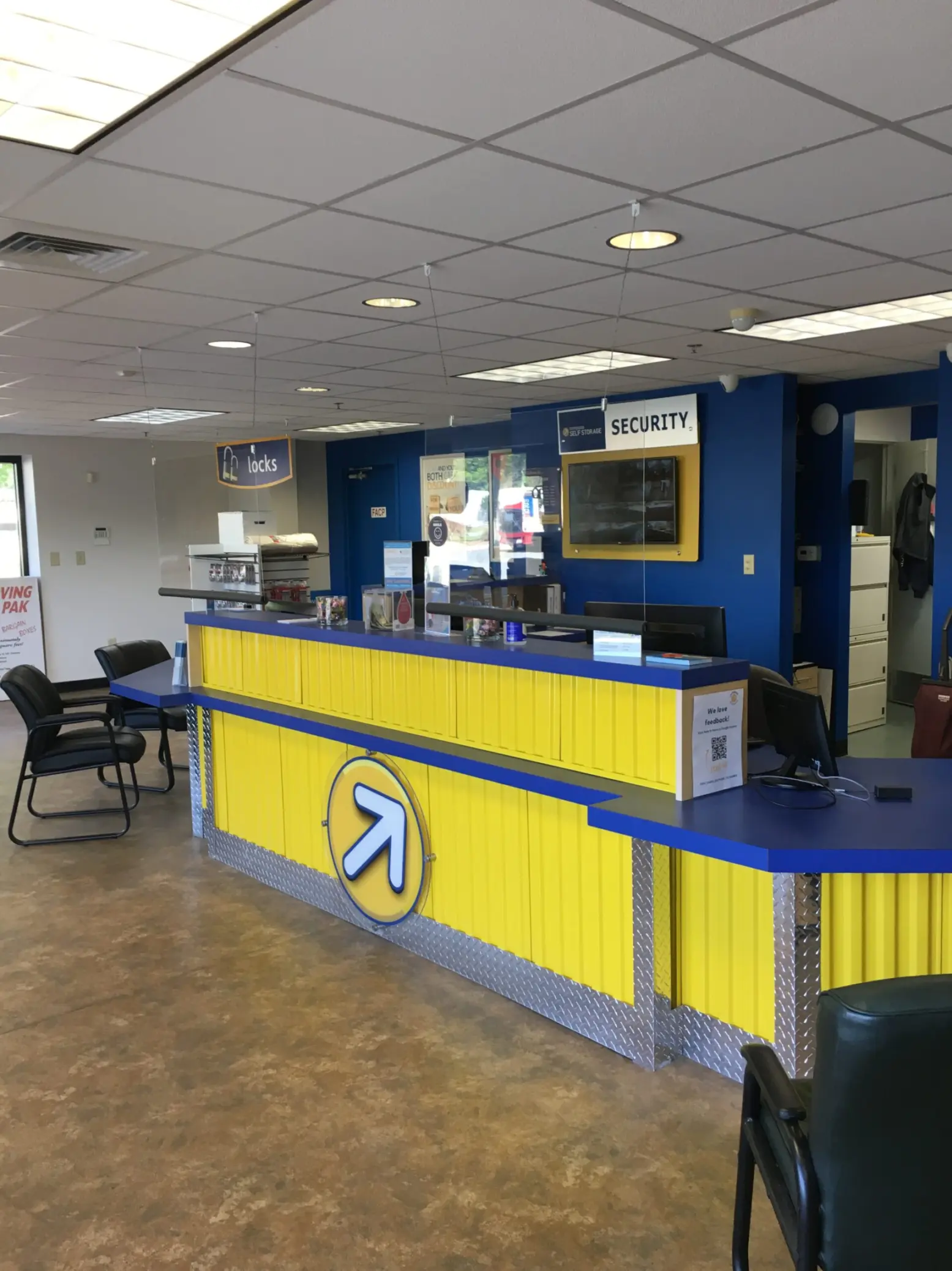 Yellow desk with the Compass logo on the front.