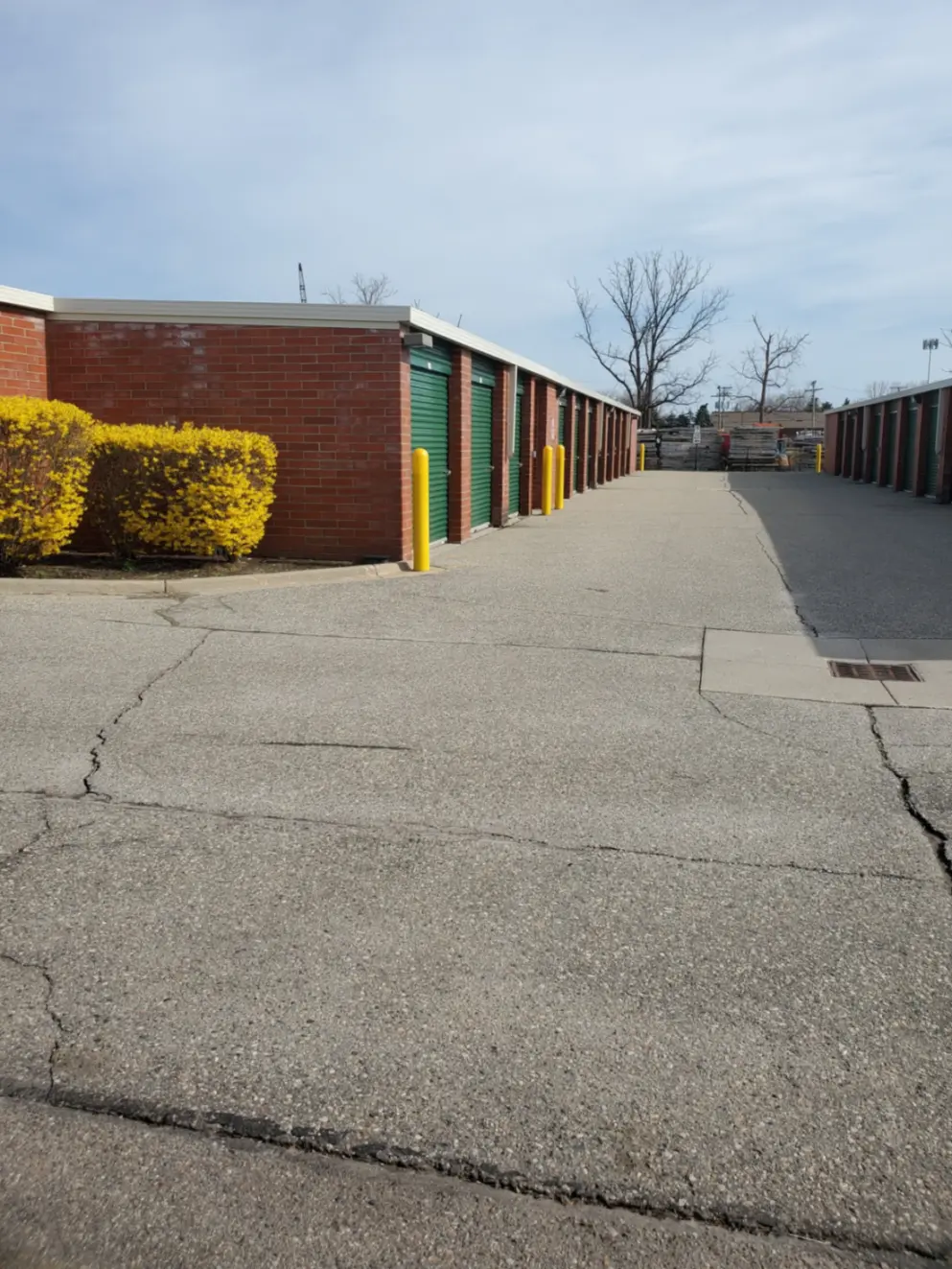 Brick Compass storage facility with green doors.
