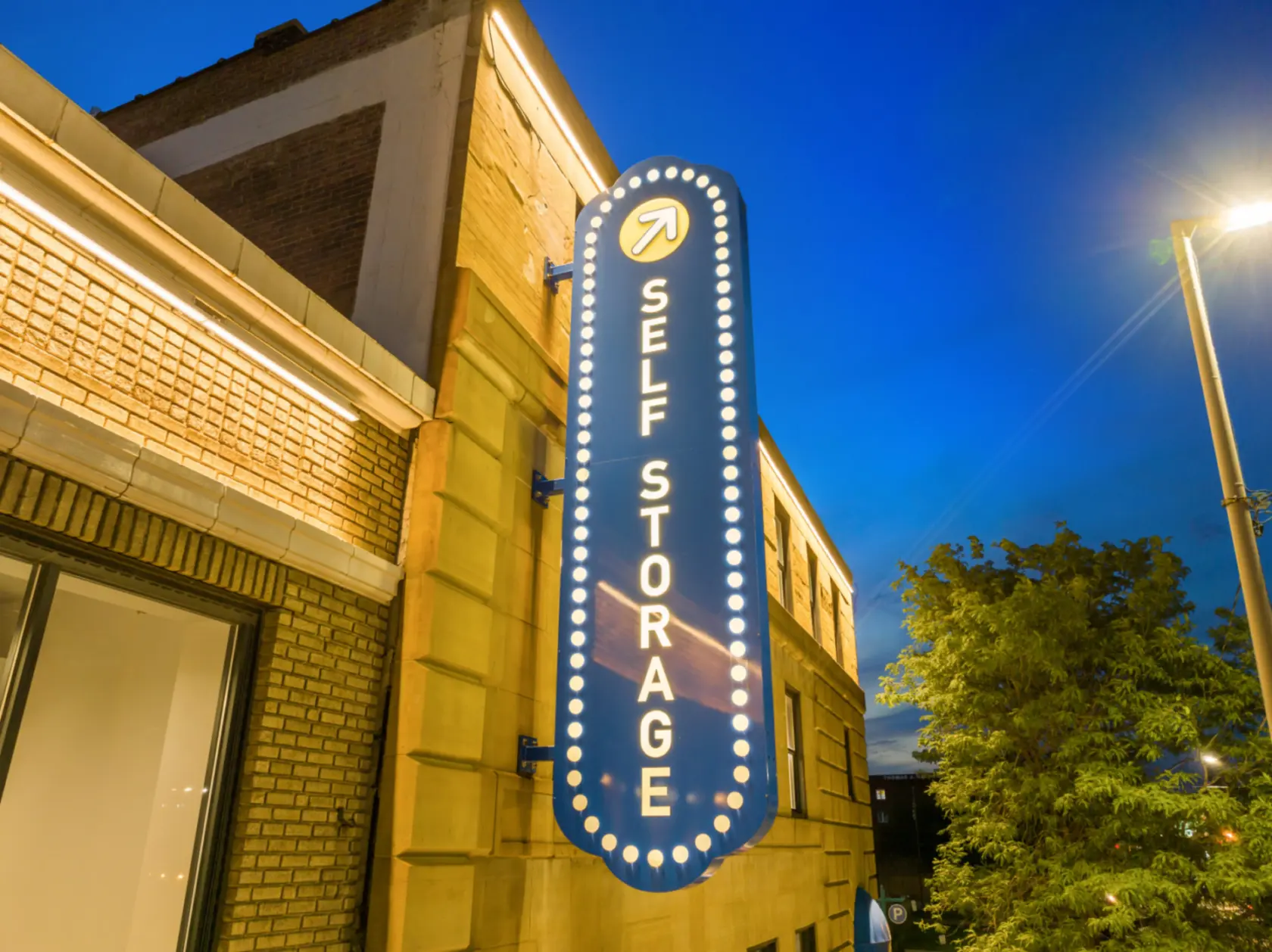 Compass Self Storage signage on building exterior.