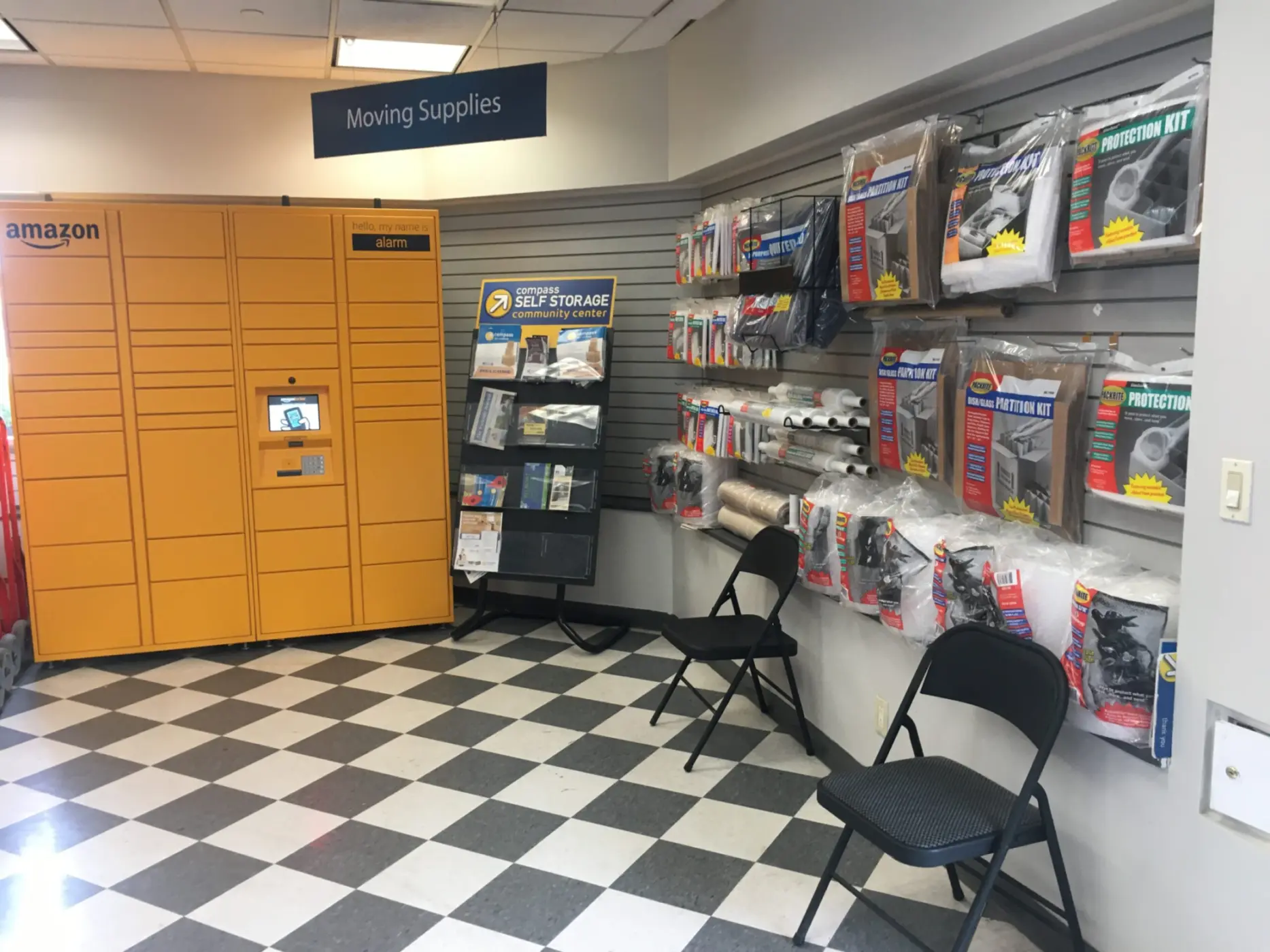 Amazon pickup box and storage supplies in Compass office.