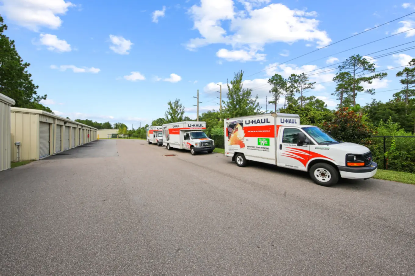 U-Haul box trucks parked in front of drive-up storage units.
