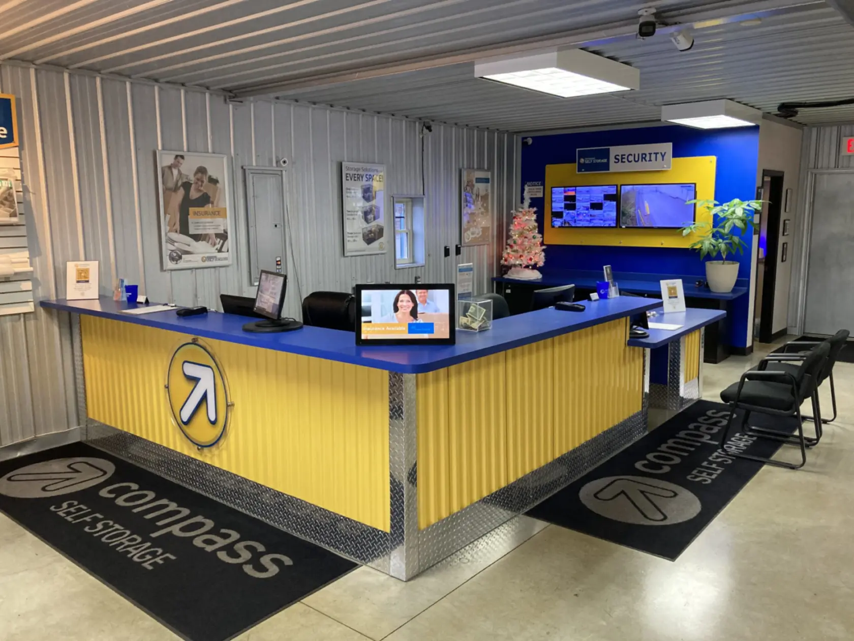 Blue and yellow Compass Self Storage front desk.