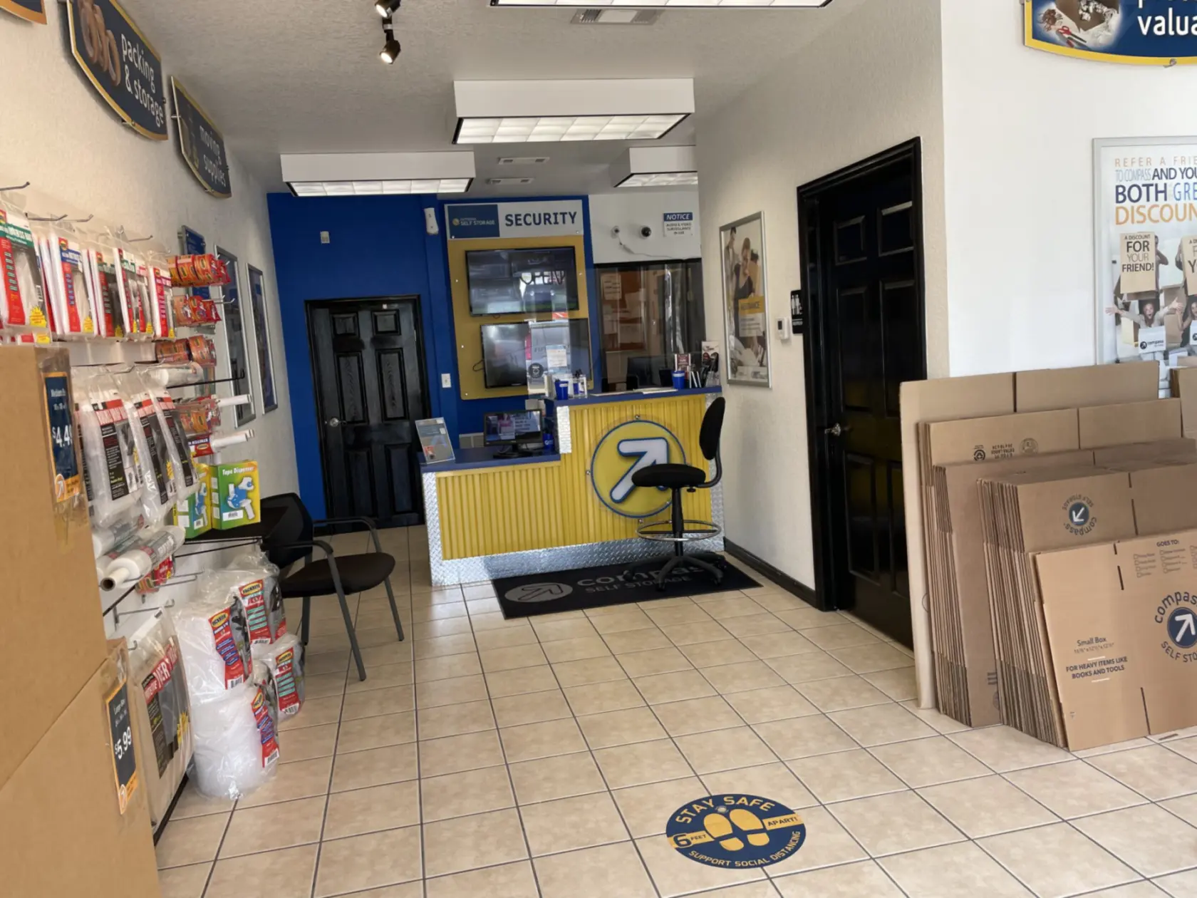 Front office of Compass Self Storage with moving supplies for sale.