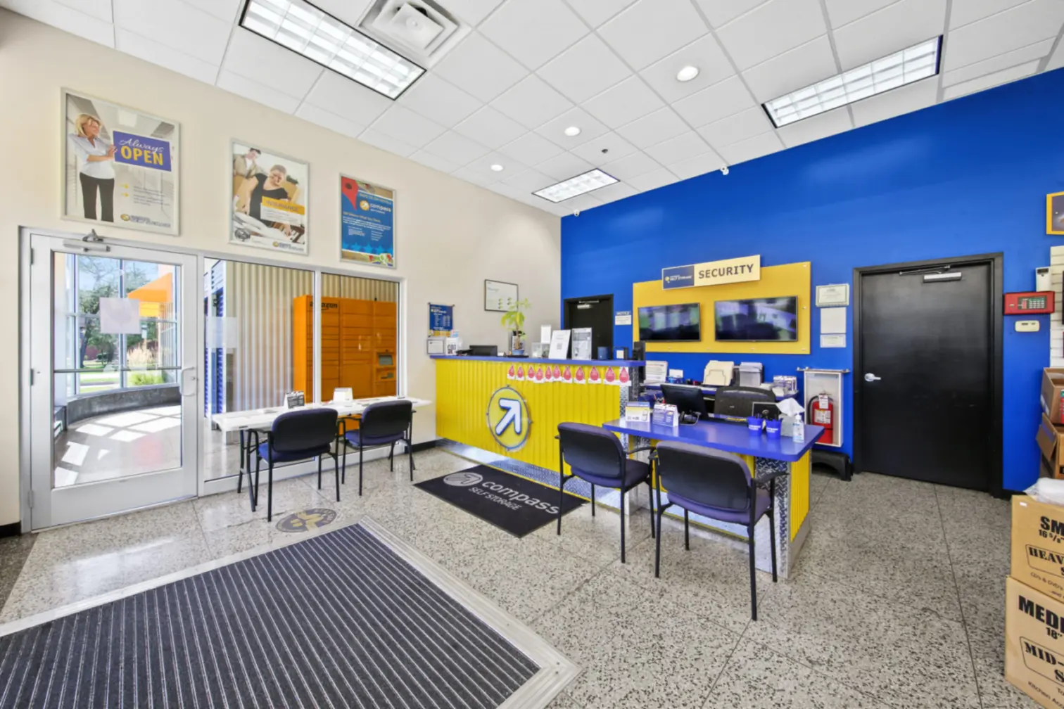 Compass Self Storage's yellow and blue themed office.