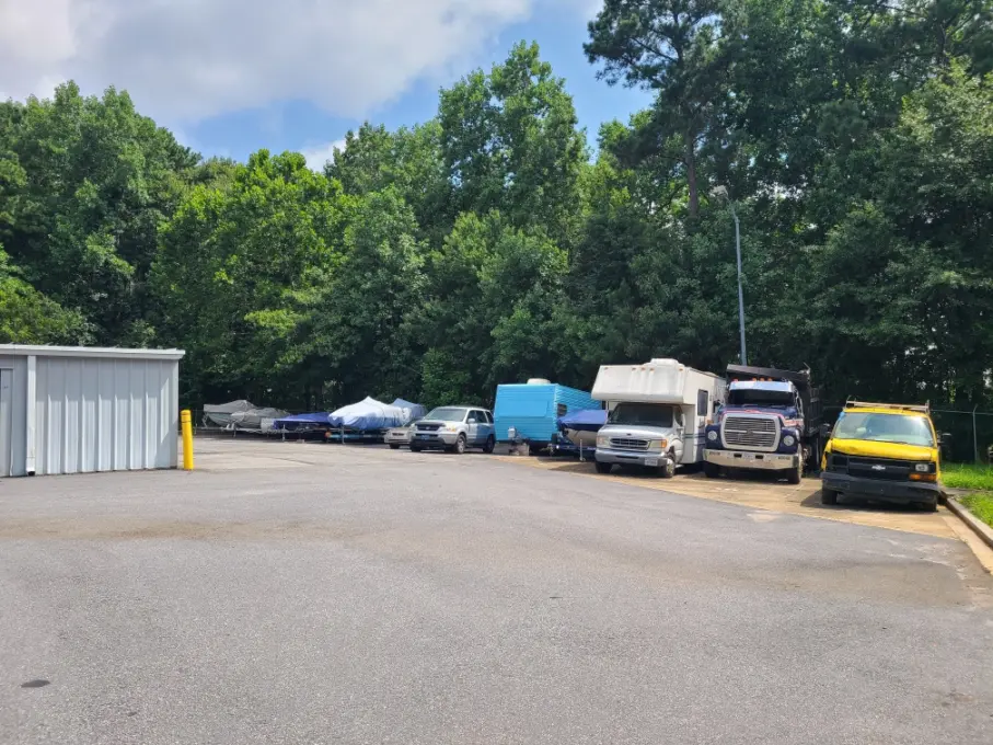 Boats and RVs parked outside.