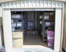 A medium sized storage unit filled with boxes.