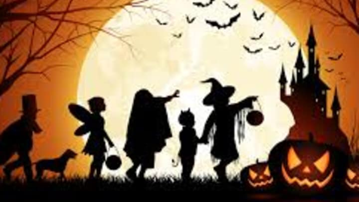 Halloween graphic depicting a group of children in costumes.
