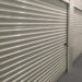 A 10x10 storage unit door with a lock.