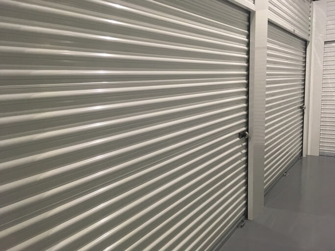 A 10x10 storage unit door with a lock.