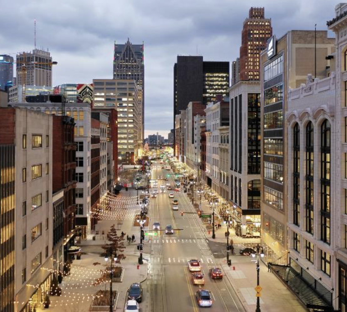 an above-street view into downtown Detroit at dusk
