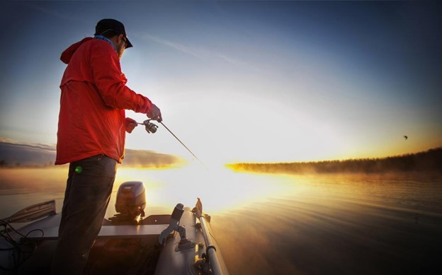 A man fishing on a boat