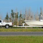 Florida boat owner towing vessel behind truck to Miami boat storage space