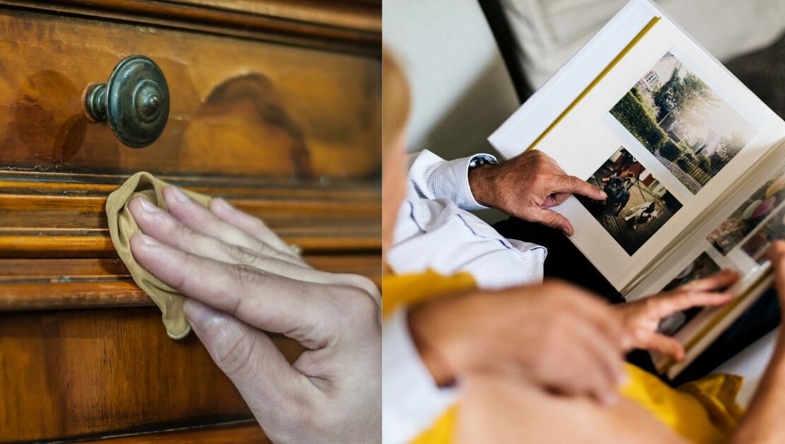 Hand wiping dust off antique furniture and elderly couple looking at an old photo album