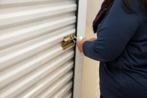 A woman opening a storage unit