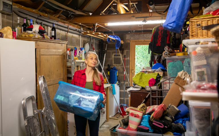 A woman organizing her garage