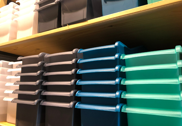 Shelves of plastic totes