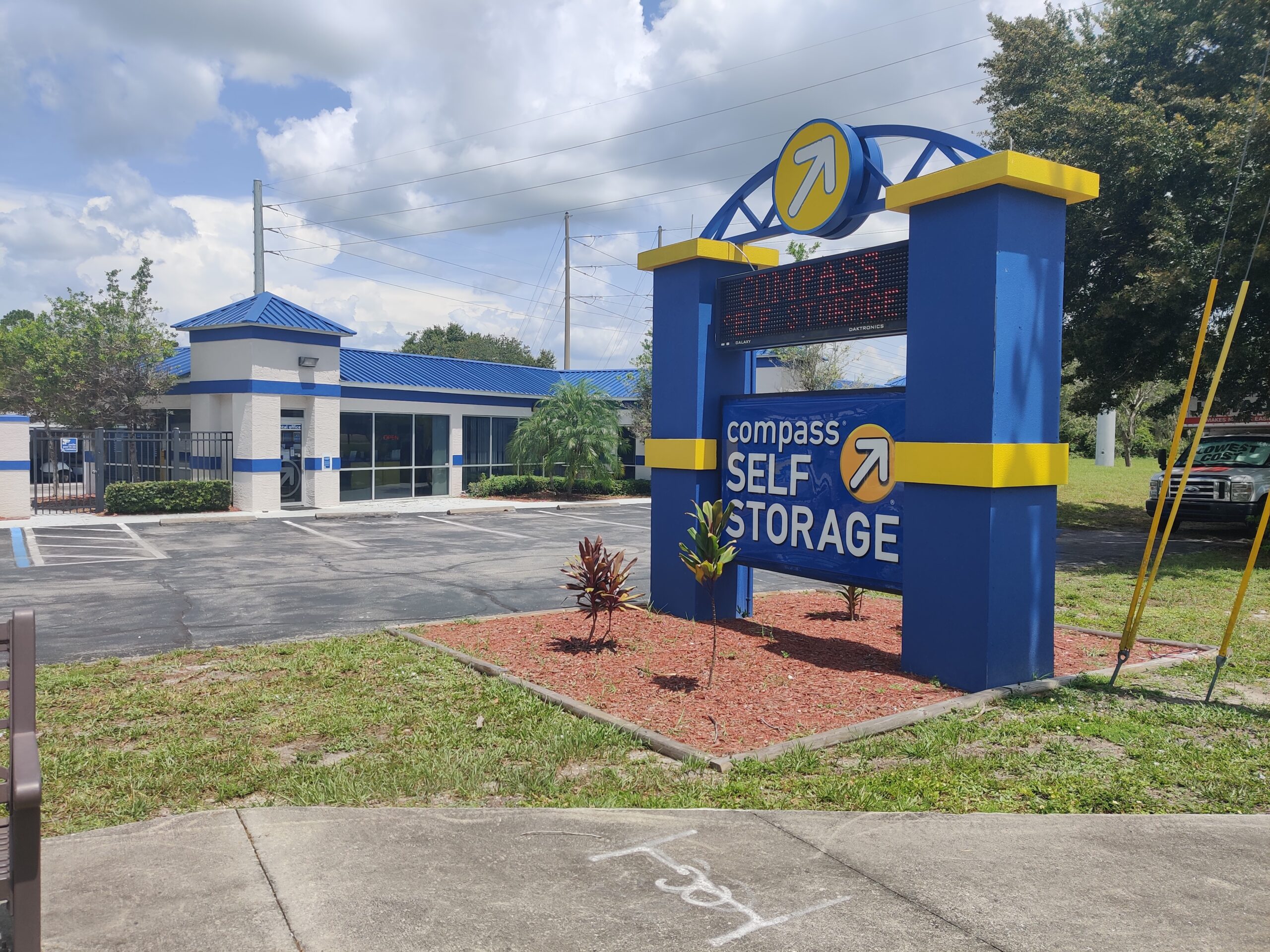 Facility signage at Compass Self Storage.