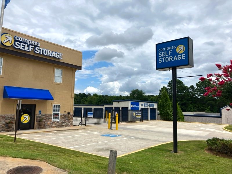 Facility signage at Compass Self Storage.