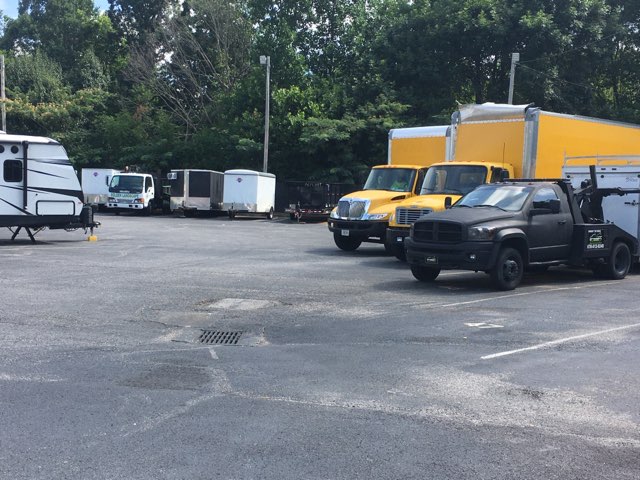 Moving trucks at Compass Self Storage.