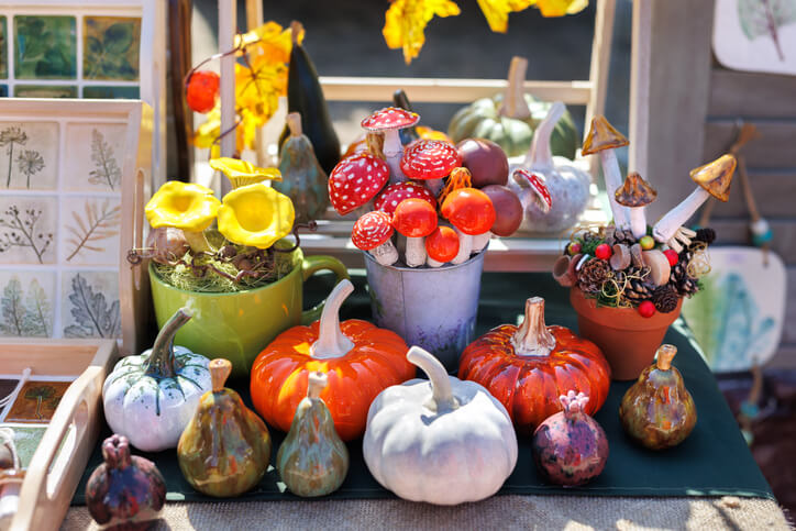 Fall decorations in a vendor’s stall at a fall festival.