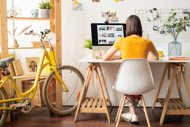 A woman working at home in her creative studio.