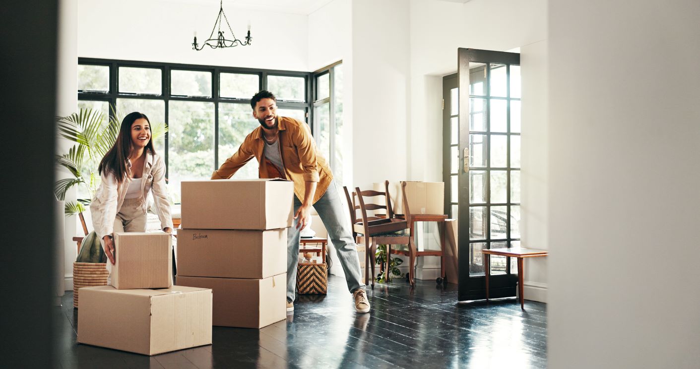A couple packing up boxes for their move