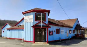 The blue exterior of Lighthouse Ministries Church in Liberty, New York
